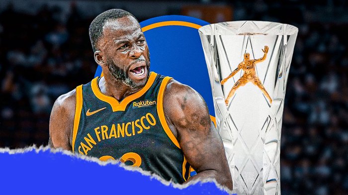 Warriors forward Draymond Green next to the Warriors logo with the NBA's Defensive Player of the Year award in the background