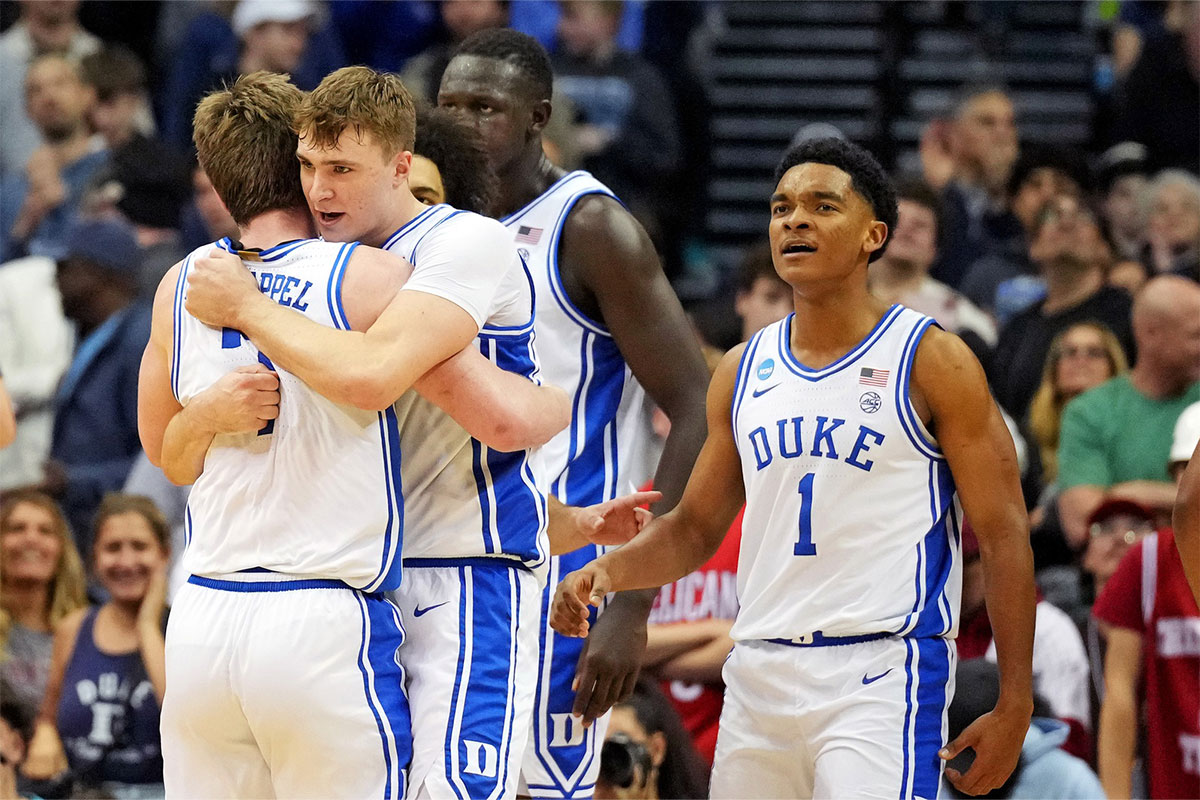 Duke Blue Devils forward Cooper Flagg (2) celebrates with guard Kon Knueppel (7) after a play during the first half against the Alabama Crimson Tide in the East Regional final of the 2025 NCAA tournament at Prudential Center.