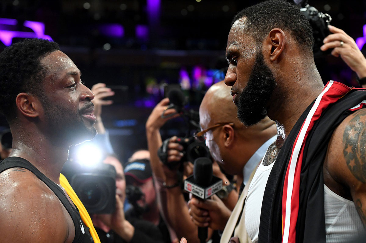 Miami Heat guard Dwyane Wade (3) and Los Angeles Lakers forward LeBron James (23) embrace after the game at Staples Center.