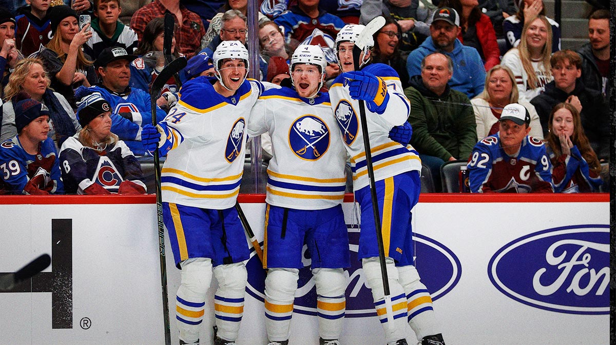 Buffalo Sabres defenseman Bowen Byram (4) celebrates his goal with center Dylan Cozens (24) and center Tage Thompson (72) in the first period against the Colorado Avalanche at Ball Arena.