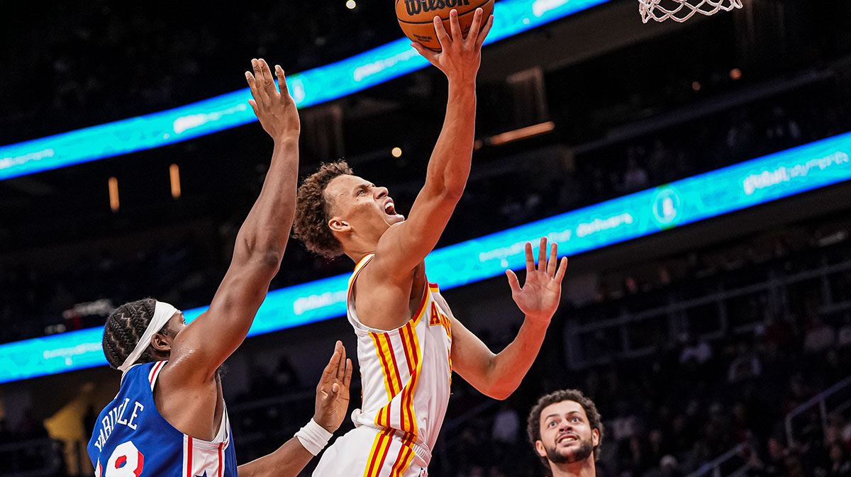 Atlanta Hawks guard Dyson Daniels (5) goes to the basket past Philadelphia 76ers forward Guerschon Yabusele (28) during the second half at State Farm Arena. 