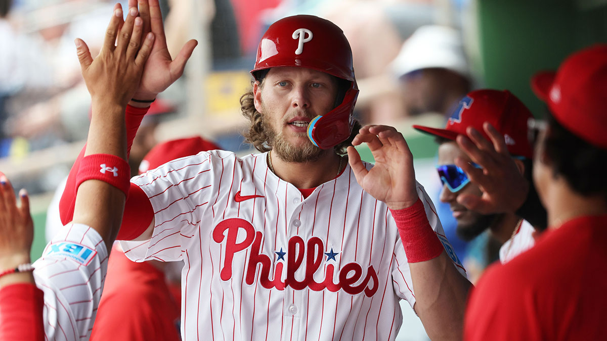 Philadelphia Phillies third base Alec Bohm (28) is congratulated after he scored a run against the Tampa Bay Rays during the first inning at BayCare Ballpark.