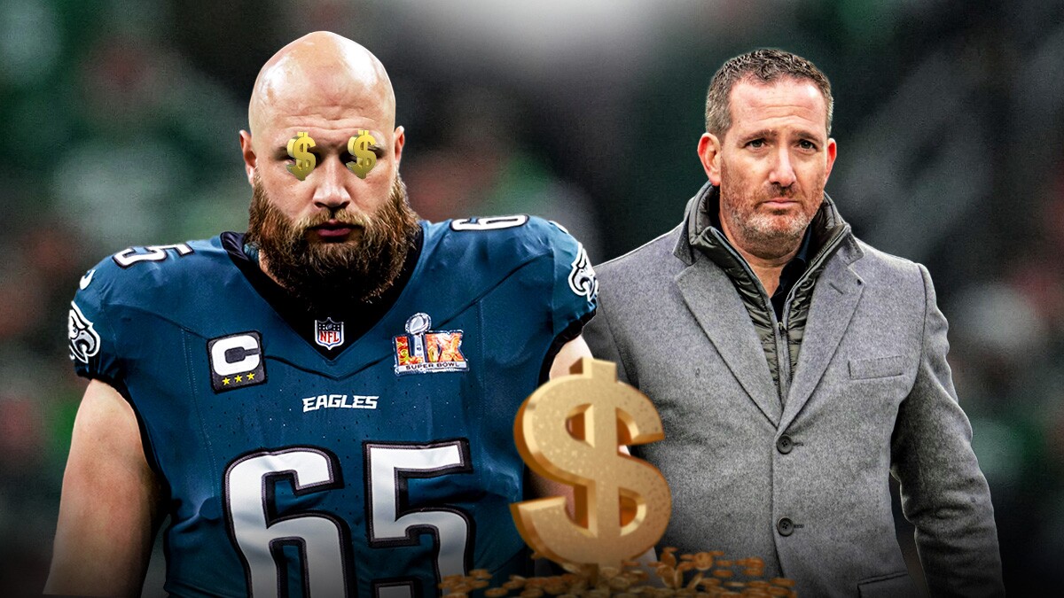 Lane Johnson with $$ over his eyes next to Howie Roseman.