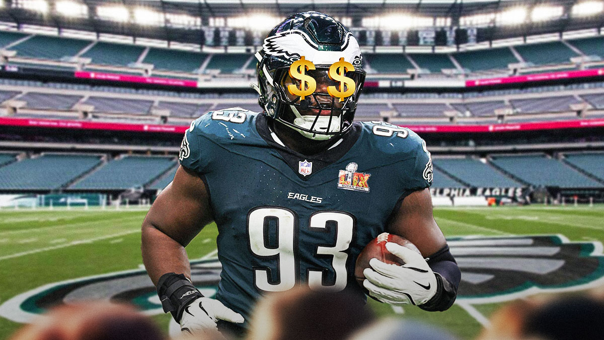 Milton Williams with $$ over his eyes in front of the Eagles stadium.