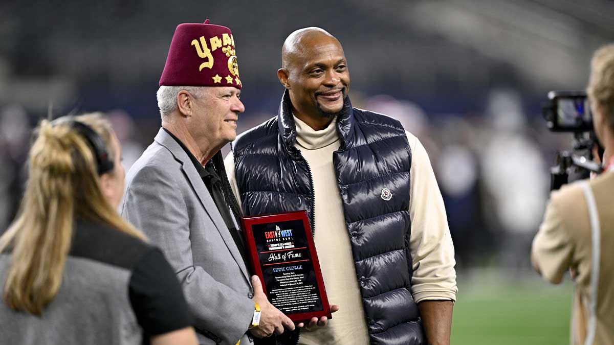 Former NFL player Eddie George is inducted into the Shrine Bowl Hall of Fame during the second half of the game between the East and the West at AT&T Stadium. Mandatory Credit: Jerome Miron-Imagn Images