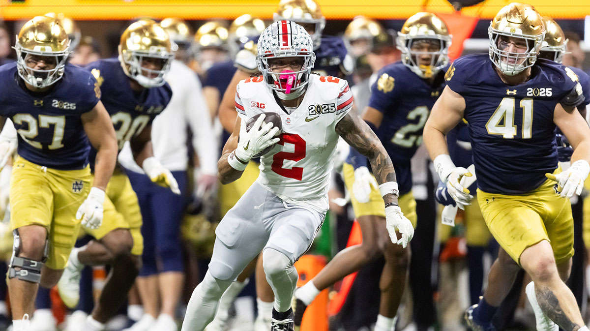 Ohio State Buckeyes wide receiver Emeka Egbuka (2) runs with the ball against the Notre Dame Fighting Irish during the second half the CFP National Championship college football game at Mercedes-Benz Stadium.