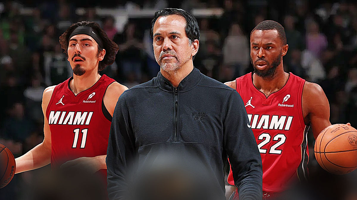 Miami Heat head coach Erik Spoelstra in the middle of Jaime Jaquez Jr. and Andrew Wiggins on either side in front of Kaseya Center.