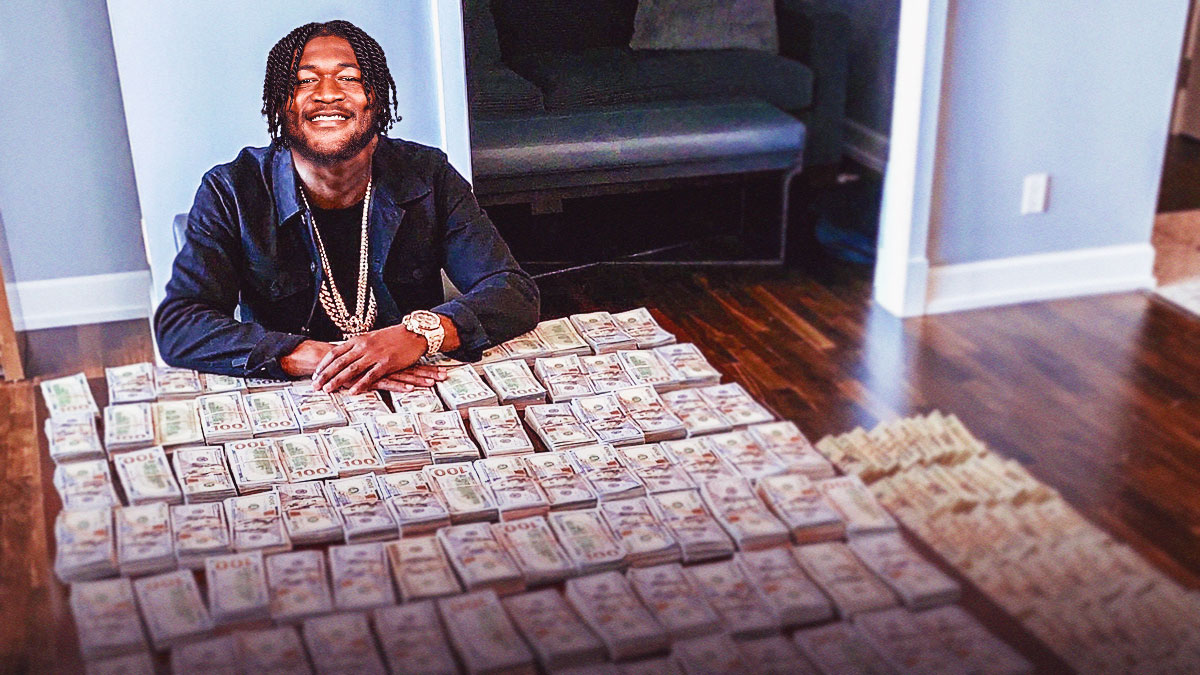 Ernest Jones IV (Seahawks) as Floyd Mayweather with money on the table.