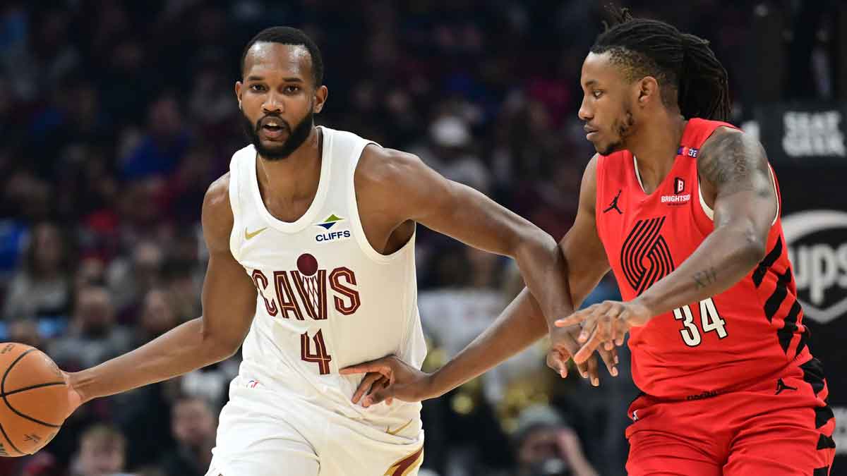 Cleveland Cavaliers forward Evan Mobley (4) brings the ball up court against Portland Trail Blazers forward Jabari Walker (34) during the first half at Rocket Arena.