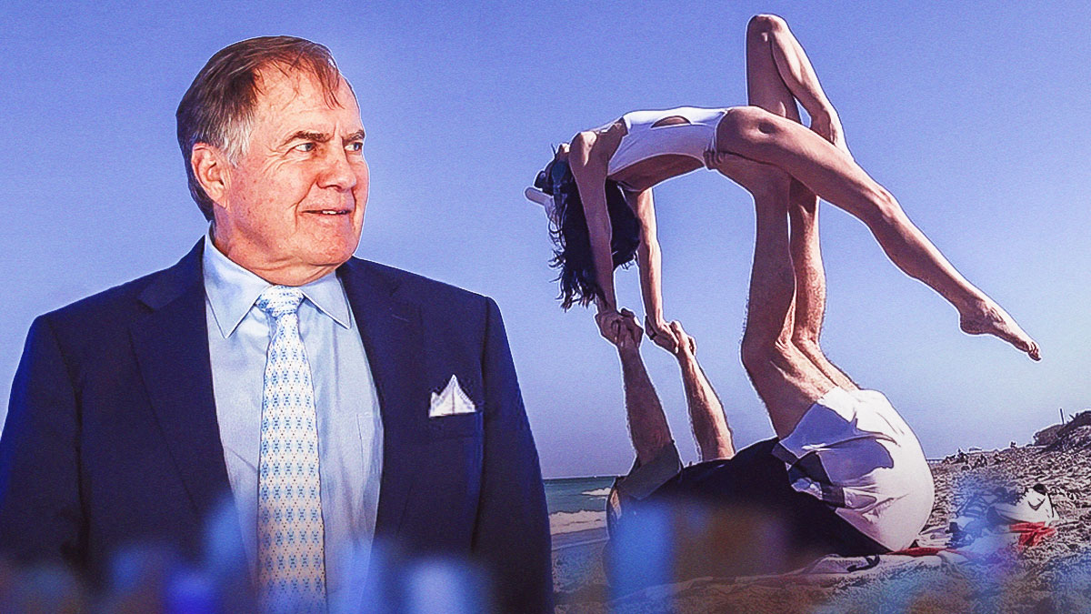 North Carolina football coach Bill Belichick in North Carolina gear next to a cutout of the attached pic as the new north carolina coach enjoed a beach day with his new girlfriend.