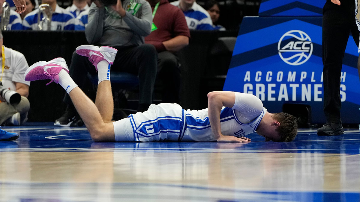 Duke Blue Devils forward Cooper Flagg (2) is injured in the first half at Spectrum Center.