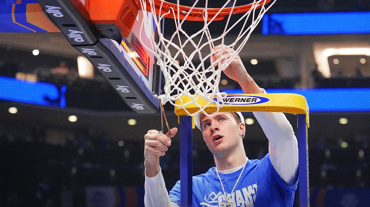 Duke Blue Devils forward Cooper Flagg (2) cuts the net after winning the 2025 ACC Conference Championship game against the Louisville Cardinals at Spectrum Center.