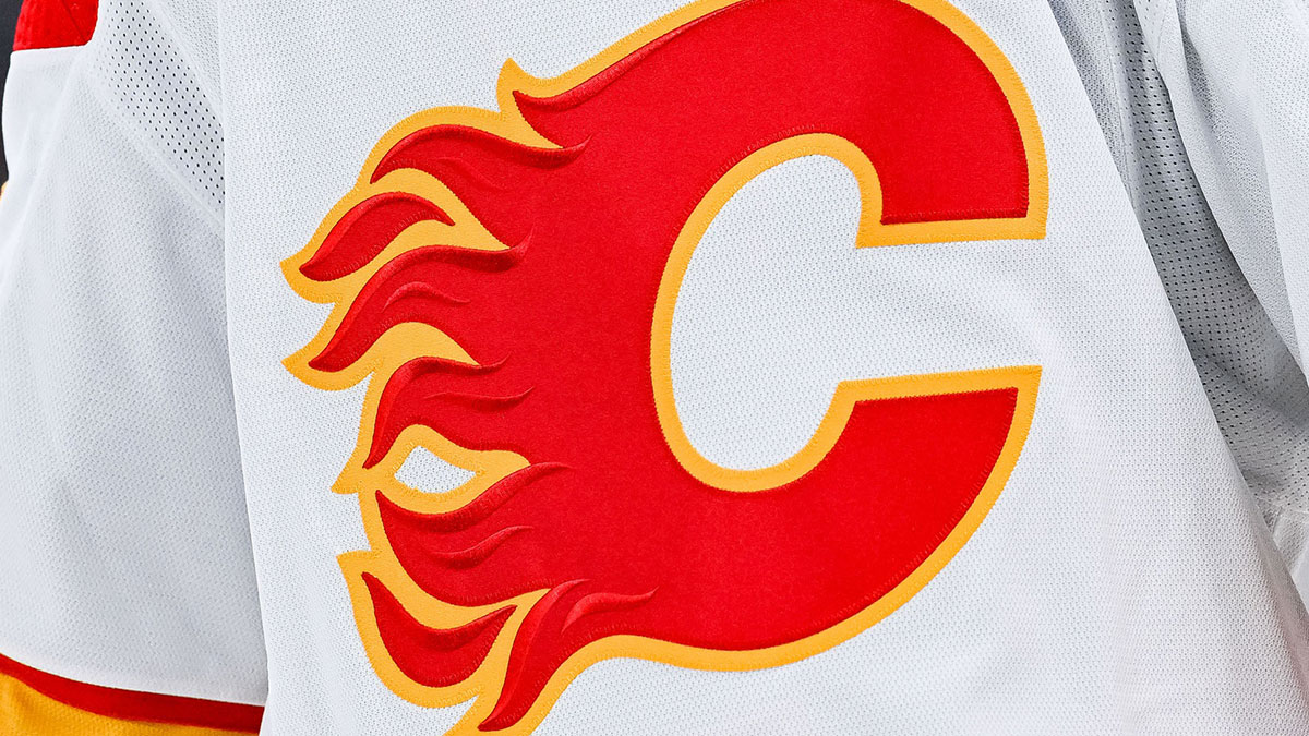 View of a Calgary Flames logo on a jersey worn by the member of the team during the second period at Bell Centre.