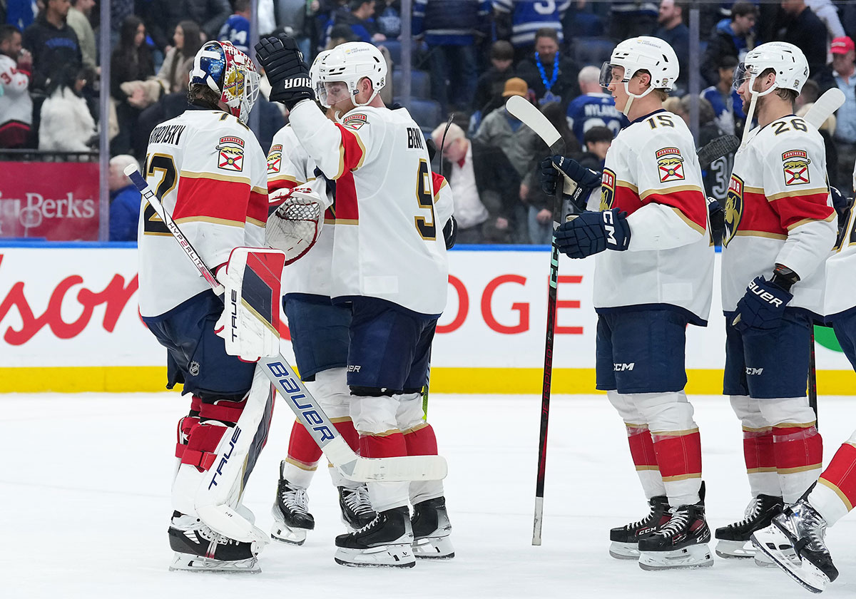 Florida Panthers center Sam Bennett (9) celebrates the win with goaltender Sergei Bobrovsky (72) against the Toronto Maple Leafs at the end of the third period at Scotiabank Arena.