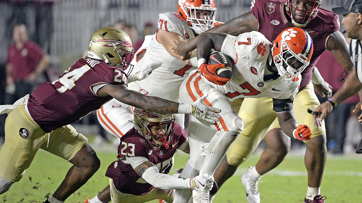 Clemson Tigers running back Phil Mafah (7) runs up the field against the Florida State Seminoles during the second half at Doak S. Campbell Stadium. Mandatory Credit: Melina Myers-Imagn Images