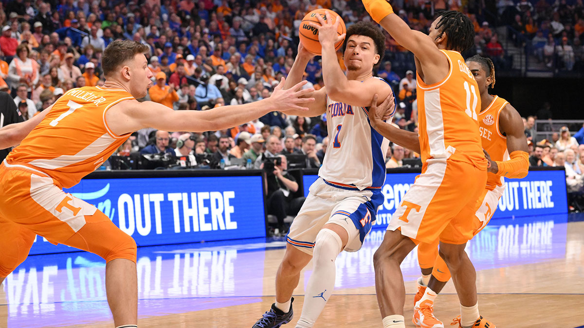 Florida Gators guard Walter Clayton Jr. (1) dribbles the ball against Tennessee Volunteers guard Jordan Gainey (11) in the second half during the 2025 SEC Championship Game at Bridgestone Arena. 