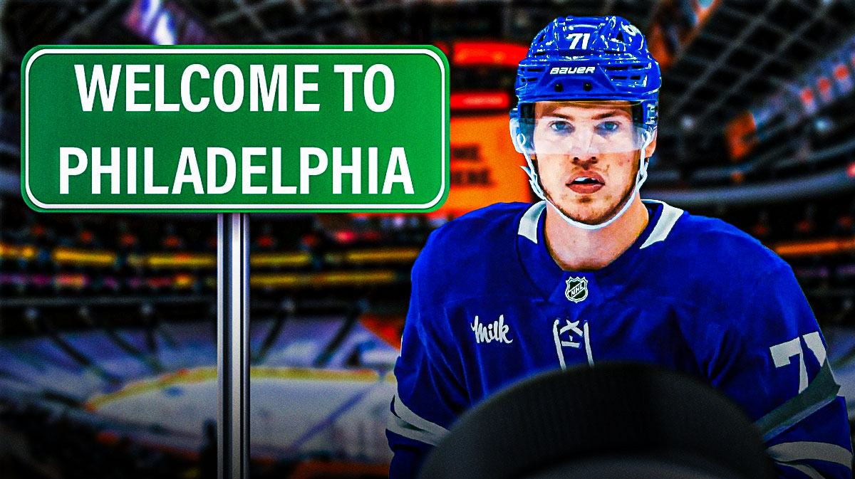 Former Maple Leafs forward Nikita Grebenkin and a "Welcome to Philadelphia" sign inside Wells Fargo Center