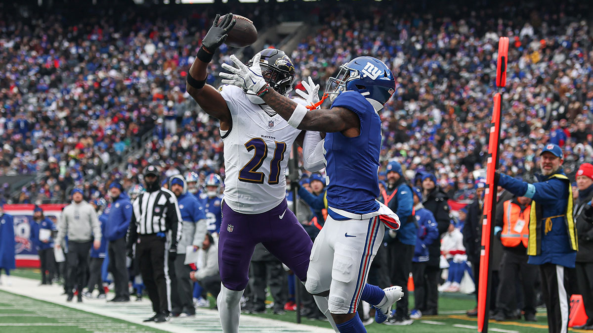 Baltimore Ravens cornerback Brandon Stephens (21) breaks up a pass intended for New York Giants wide receiver Malik Nabers (1) during the first half at MetLife Stadium. Stephens (21) was called for pass interference on the play.