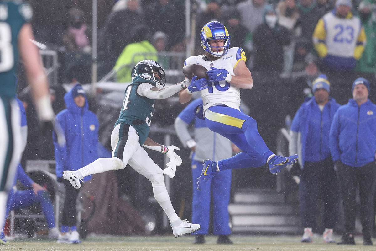 Los Angeles Rams wide receiver Cooper Kupp (10) catches the ball as Philadelphia Eagles cornerback Isaiah Rodgers (34) defends in a 2025 NFC divisional round game at Lincoln Financial Field.