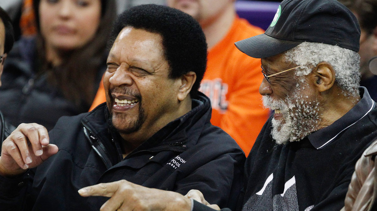 Former Boston Celtics center Bill Russell talks with former Seattle Supersonics guard Freddy Brown during the second half of a game between the Washington Huskies and Oregon State Beavers at Alaska Airlines Arena at Hec Edmundson Pavilion. 