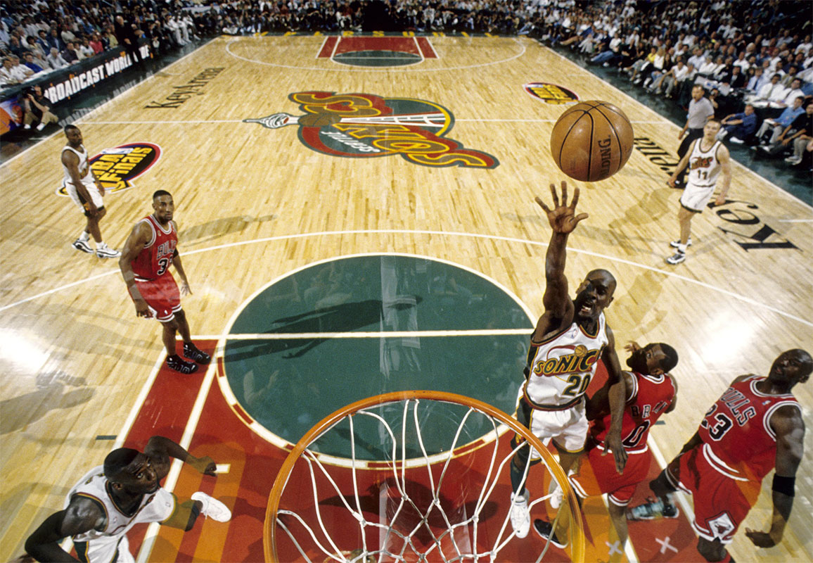 Seattle Supersonics guard Gary Payton (20) lays the ball up against the Chicago Bulls during the 1996 NBA Finals at Key Arena.