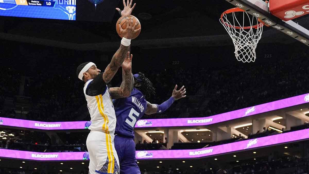 Golden State Warriors guard Gary Payton II (0) goes to the basket against Charlotte Hornets center Mark Williams (5) during the second quarter at Spectrum Center.