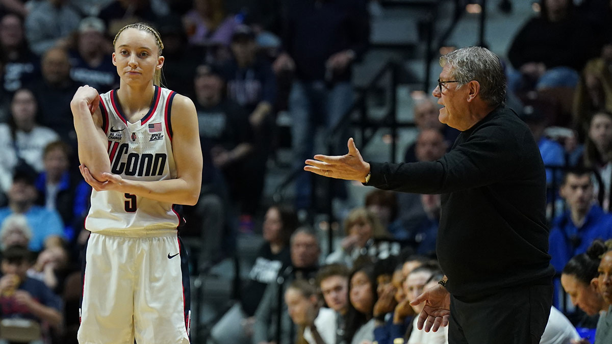 UConn Huskies head coach Geno Auriemma talks to guard Paige Bueckers (5) from the sideline as they take on the St. John's Red Storm at Mohegan Sun Arena