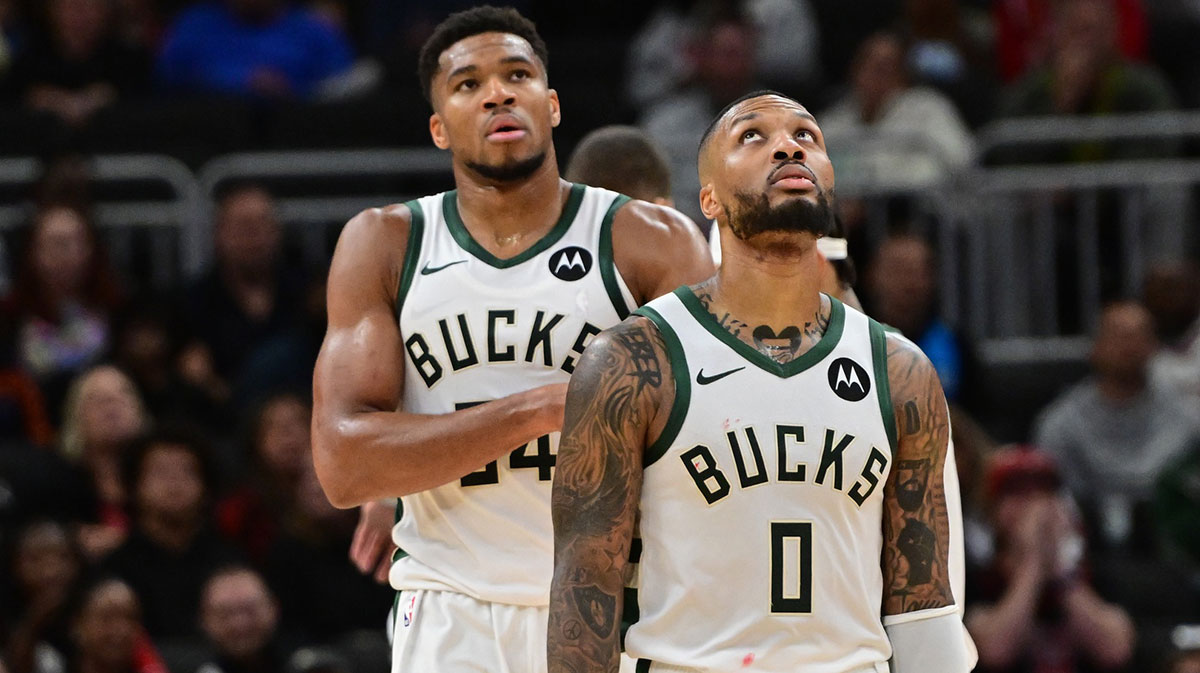 Milwaukee Bucks forward Giannis Antetokounmpo (34) and guard Damian Lillard (0) look on in the second quarter against the Chicago Bulls at Fiserv Forum. 