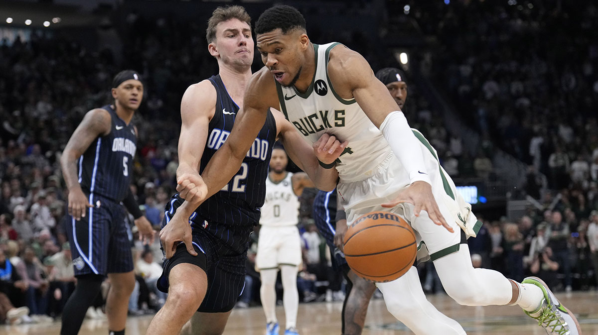 Milwaukee Bucks forward Giannis Antetokounmpo (34) drives against Orlando Magic forward Franz Wagner (22) in the first half at Fiserv Forum.