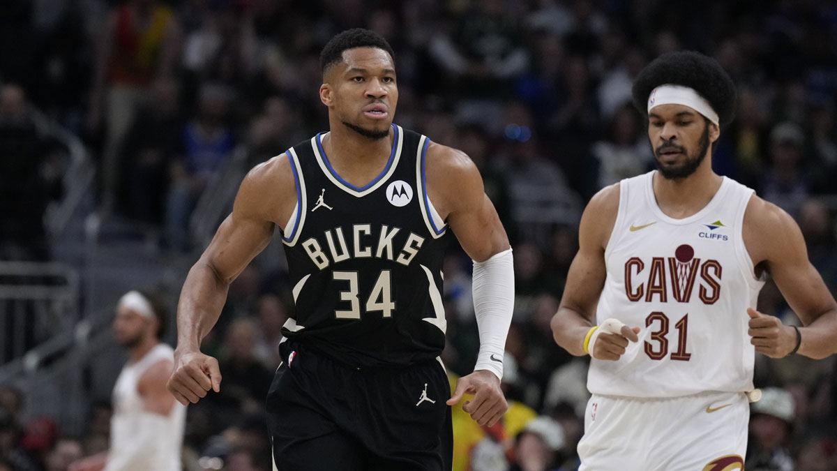 Milwaukee Bucks forward Giannis Antetokounmpo (34) runs down the court after making a basket against Cleveland Cavaliers center Jarrett Allen (31) in the first half at Fiserv Forum.