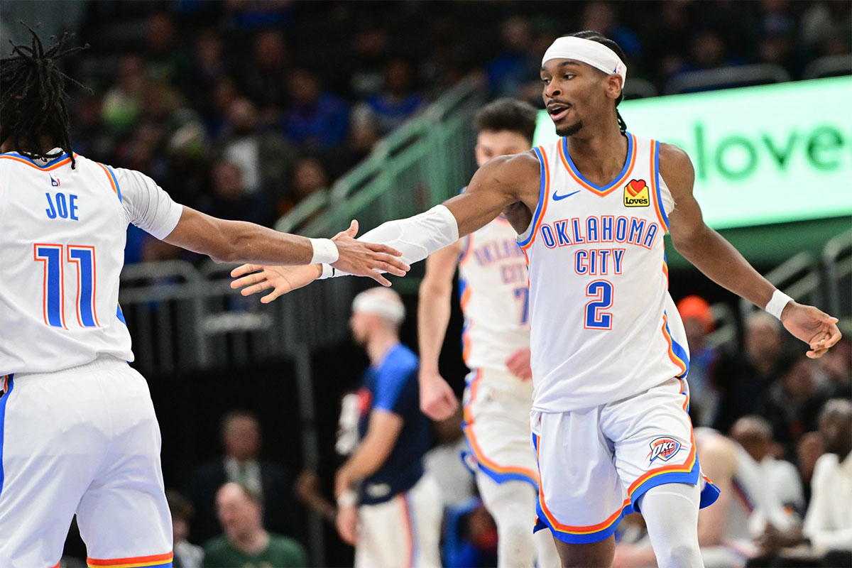 Oklahoma City Thunder Guard Shai Gilgeous-Alexander (2) is celebrated with the guard Isaiah Joe (11) after the results in the fourth quarter against Milvaukee Bucks at Fiserv Forum.