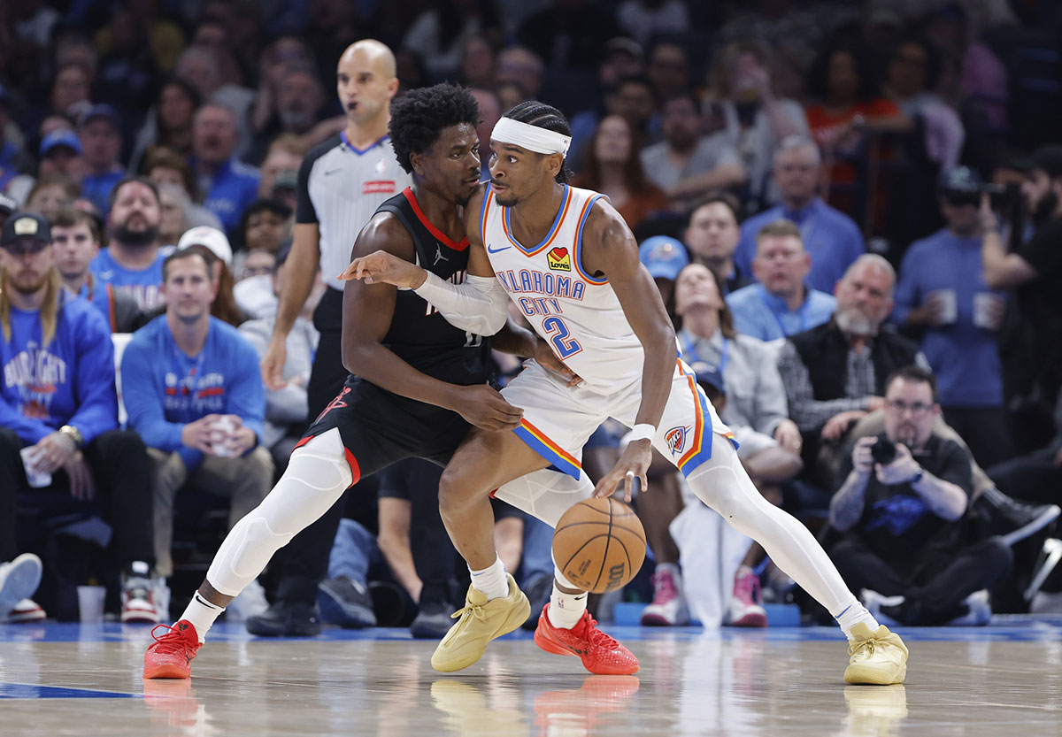 Oklahoma City Thunder Guard Shai Gilgeous-Alexander (2) Vehicles against Houston Rocket Guard Aaron Holiday (0) during the second half in Center Paicom.