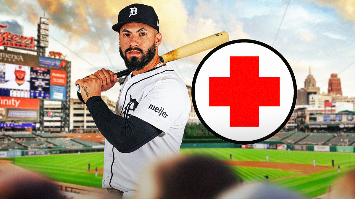 Tigers infielder Gleyber Torres at Comerica Park with a medical cross next to him.