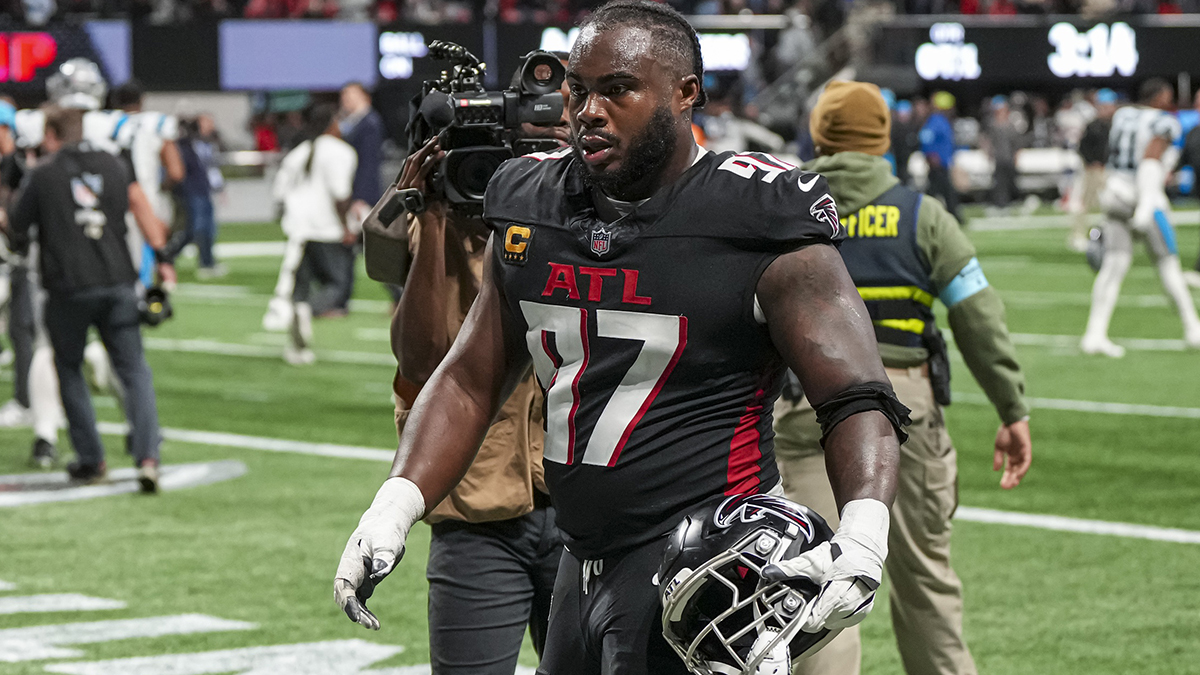 Atlanta Falcons defensive end Grady Jarrett (97) leaves the field after the Falcons were defeated by the Carolina Panthers in overtime at Mercedes-Benz Stadium.