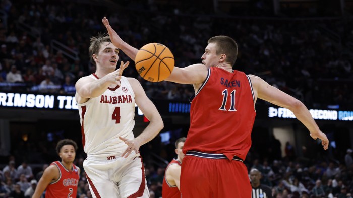 Alabama Crimson Tide forward Grant Nelson (4) plays the ball around St. Mary's Gaels center Mitchell Saxen (11) in the second half during the NCAA Tournament Second Round at Rocket Arena. Mandatory Credit: Rick Osentoski-Imagn Images
