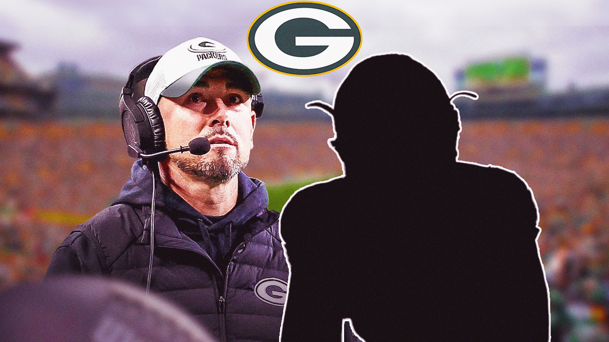 Packers HC Matt LaFleur looking serious. A silhouette cornerback next to him. Packers logo above them