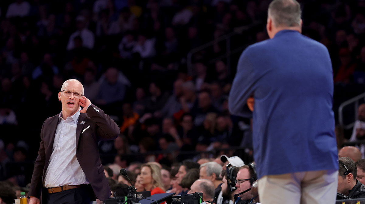 Connecticut Huskies head coach Dan Hurley talks to Creighton Bluejays head coach Greg McDermott during the first half at Madison Square Garden.