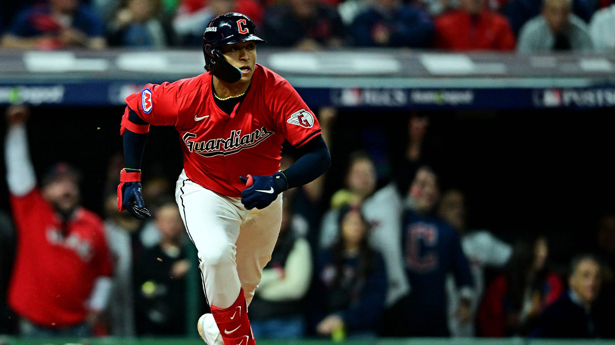 Cleveland Guardians catcher Bo Naylor (23) hits an RBI double during the second inning against the New York Yankees during game five of the ALCS for the 2024 MLB playoffs at Progressive Field. 