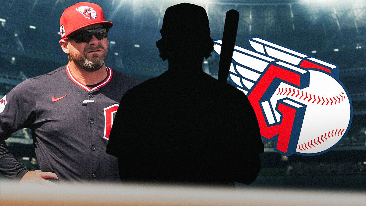 Stephen Vogt looking at silhouette of Bo Naylor. Guardians logo in the background.