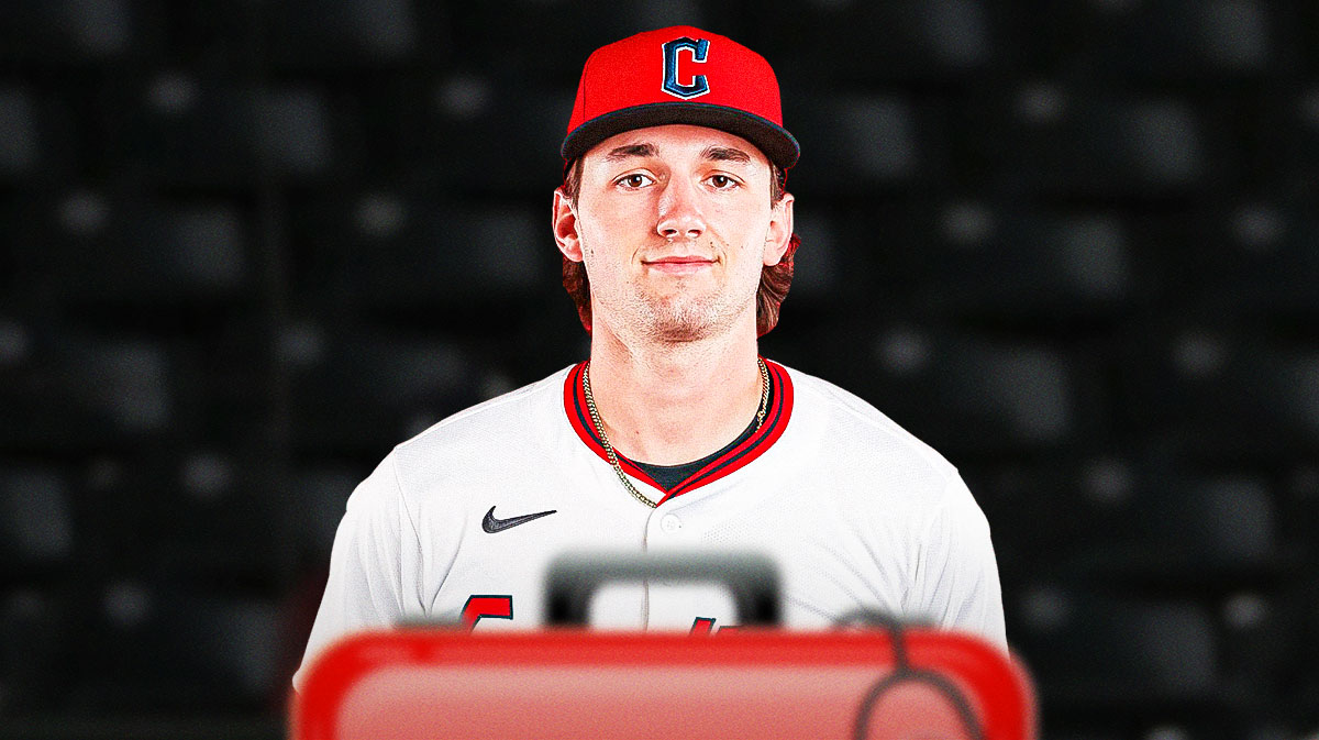 Photo: Chase DeLauter in Guardians jersey with medical kit beside him