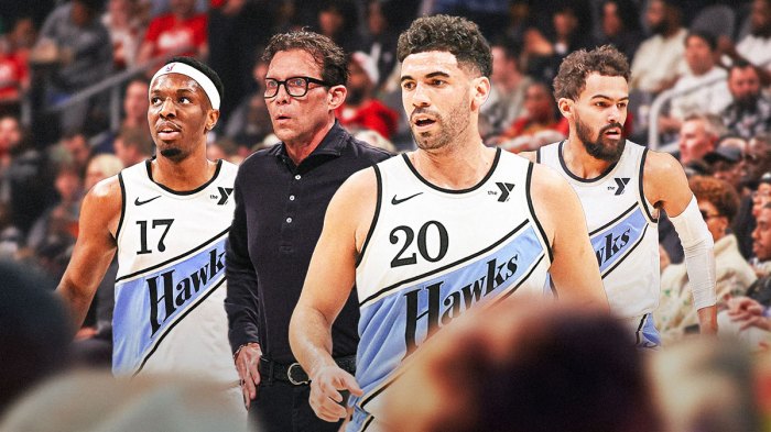 Georges Niang in the middle of Trae Young, Onyeka Okongwu, and Quin Snyder.