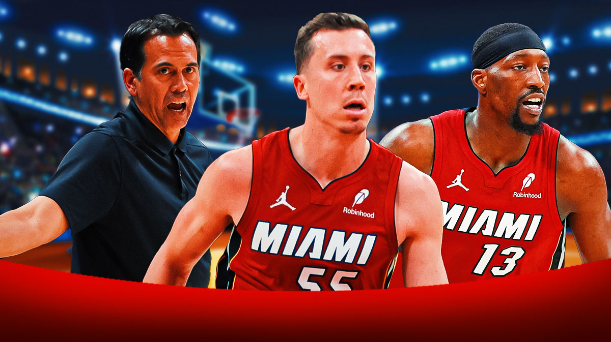 Miami Heat star Duncan Robinson in the middle with Bam Adebayo and Erik Spoelstra on either side in front of Kaseya Center.