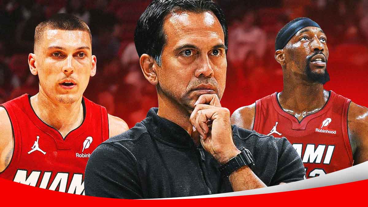 Miami Heat head coach Erik Spoelstra in the middle with Tyler Herro and Bam Adebayo on either side in front of Kaseya Center.