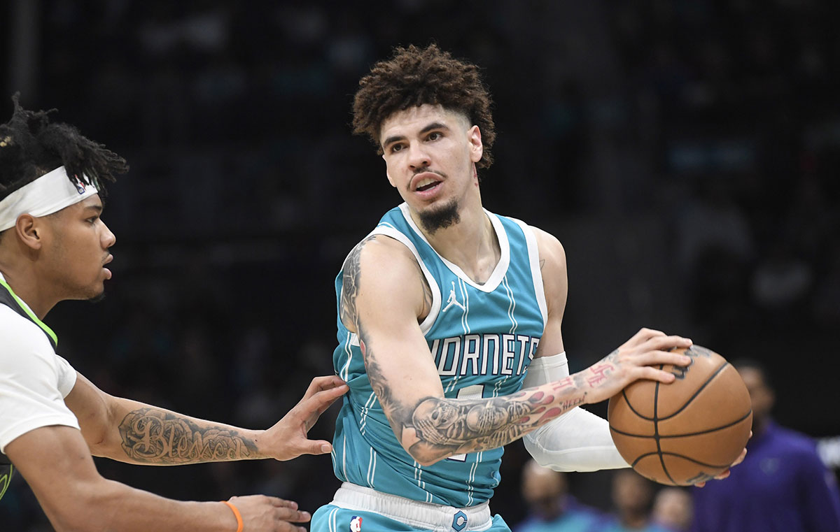 Hornets Guard Lamelo Ball (1) Controls the ball while defending the Minnesota Timbervolves Guard Terrence Shannon Jr. (00) During the first half in Centurum Centrum