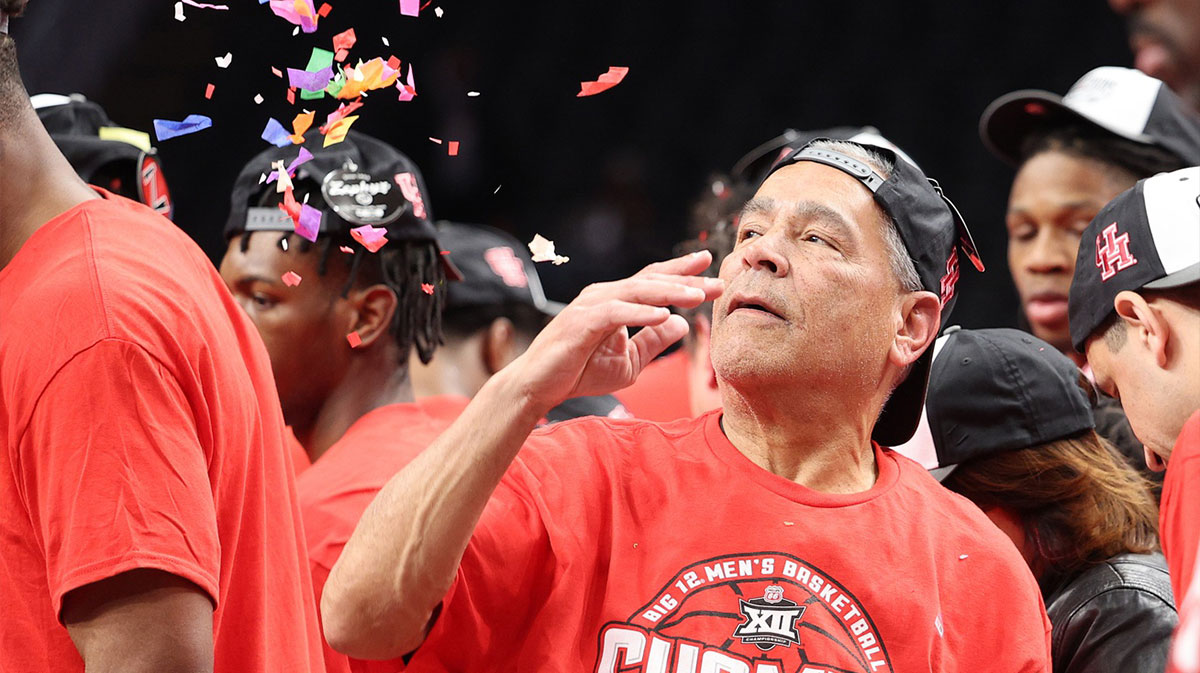 The Houston Cougars and head coach Kelvin Sampson react after defeating the Arizona Wildcats in the Big 12 Conference Tournament Championship game at T-Mobile Center.