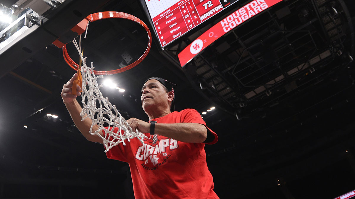 Houston Cougars head coach Kelvin Sampson cuts the net after defeating the Arizona Wildcats in the Big 12 Conference Tournament Championship game at T-Mobile Center.