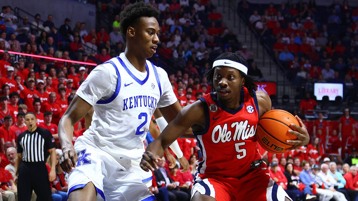 Mississippi Rebels guard Jaylen Murray (5) drives to the basket as Kentucky Wildcats guard Jaxson Robinson (2) defends during the second half at The Sandy and John Black Pavilion at Ole Miss.