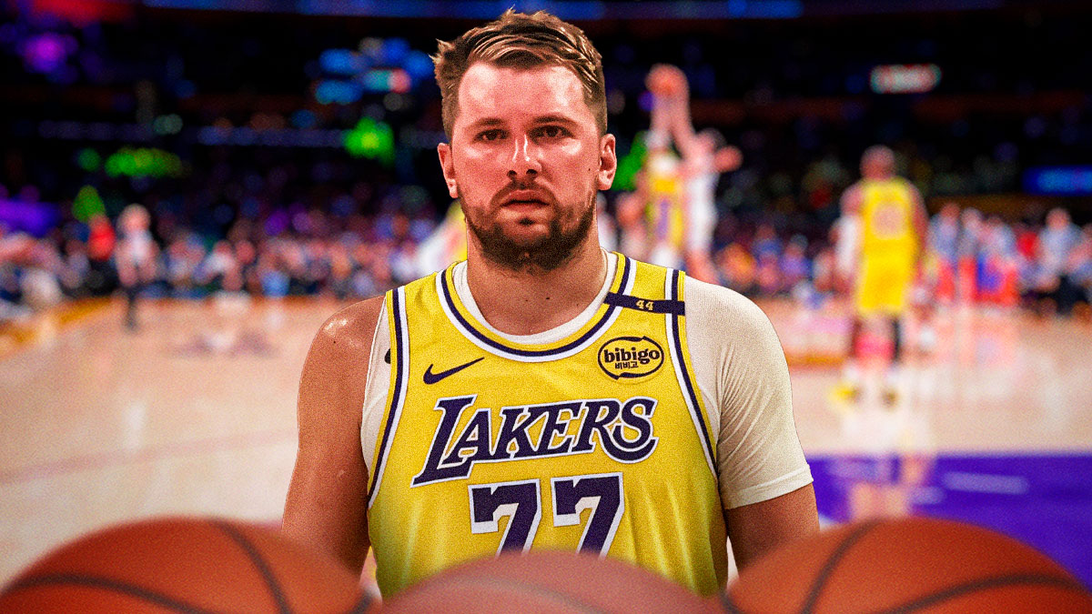 LA Lakers player Luka Doncic with the Lakers arena in the background, defense
