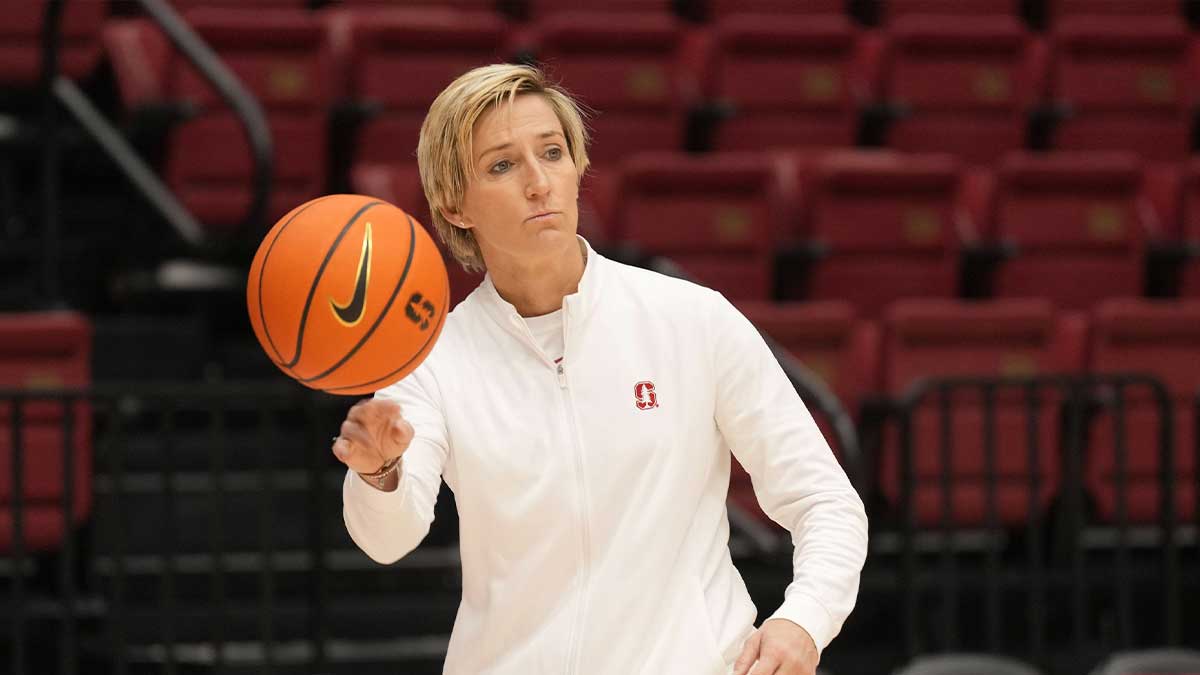 Stanford Cardinal associate head coach Kate Paye throws a ball before the game against the Tennessee Lady Vols at Maples Pavilion.