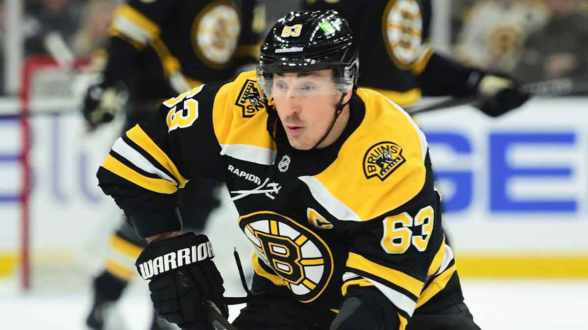 Boston Bruins left wing Brad Marchand (63) skates with the puck during the third period against the New York Islanders at TD Garden. 